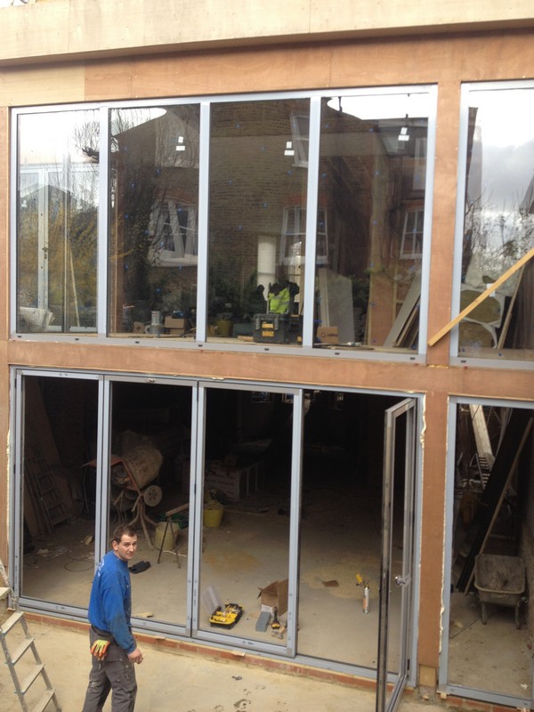 Aluminium bi-fold doors with two-storey glazing in Eltham