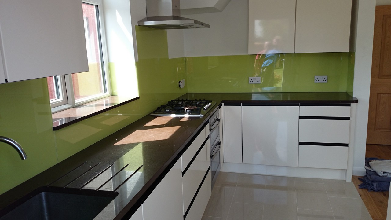 Lime green glass kitchen splashback installed by Eltham glaziers