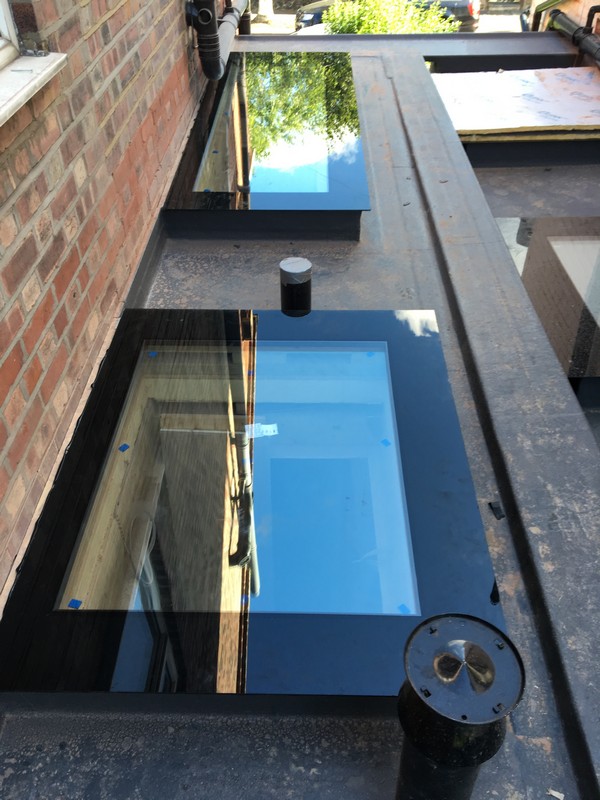 Multiple flat roof skylights on extension in Eltham
