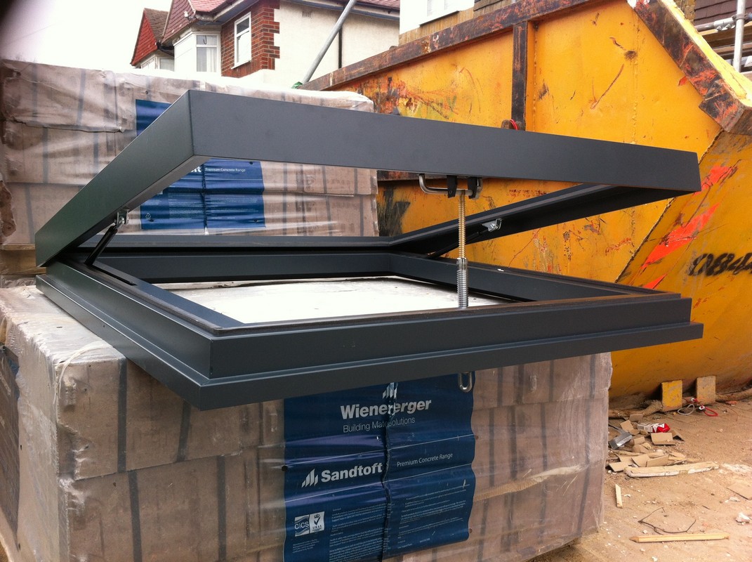 Opening flat roof skylight in anthracite grey installed in Eltham