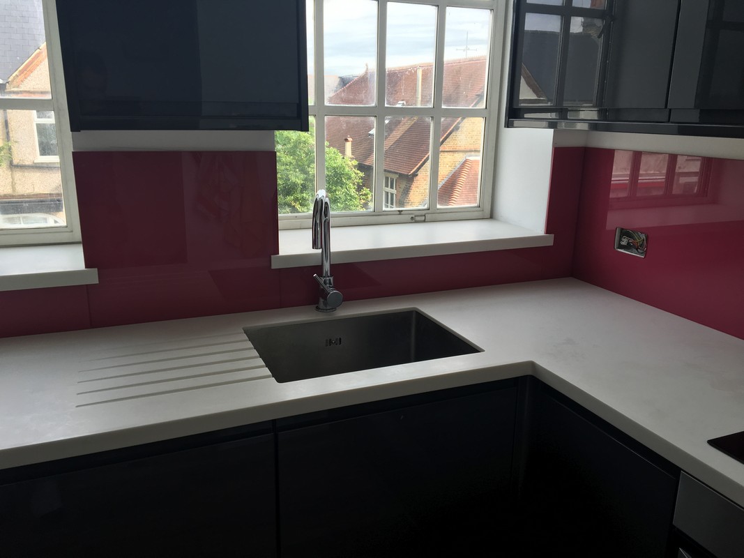 Deep plum coloured glass splashback in modern Eltham kitchen